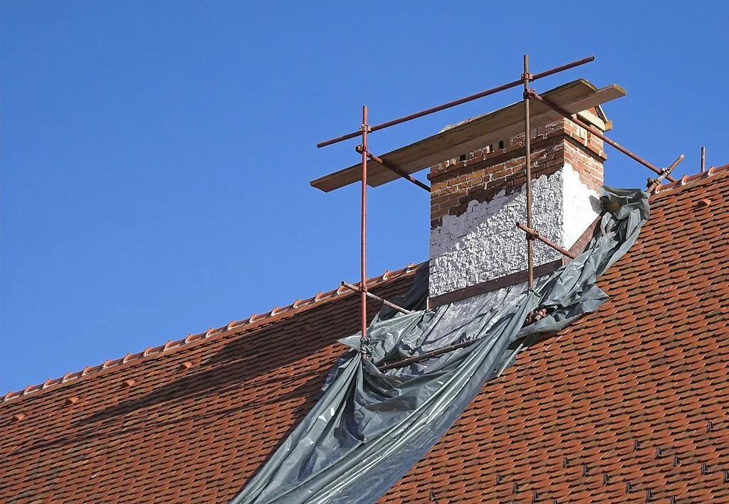 Failed chimney render and crown before repair